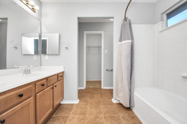 8907 Wildbird Ln, Humble, TX 77338 - bathroom featuring vanity, tile patterned flooring, shower / tub combo, and baseboards