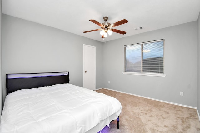 8907 Wildbird Ln, Humble, TX 77338 - carpeted bedroom featuring baseboards and a ceiling fan