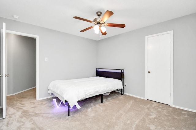 8907 Wildbird Ln, Humble, TX 77338 - bedroom featuring carpet, baseboards, and ceiling fan