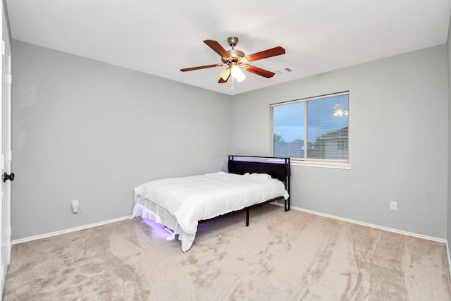 8907 Wildbird Ln, Humble, TX 77338 - bedroom featuring carpet flooring, baseboards, and ceiling fan