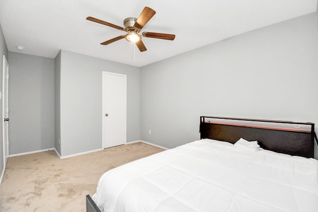 8907 Wildbird Ln, Humble, TX 77338 - carpeted bedroom featuring baseboards and a ceiling fan
