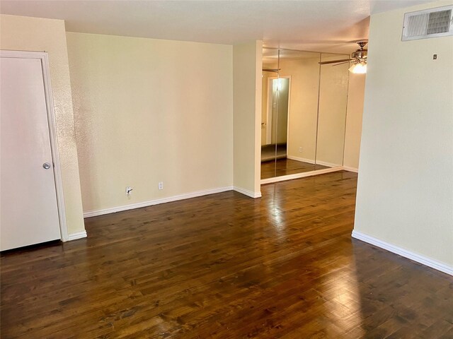 11550 Chimney Rock Rd Unit 329, Houston, TX 77035 - unfurnished room with ceiling fan, dark wood-type flooring, and baseboards