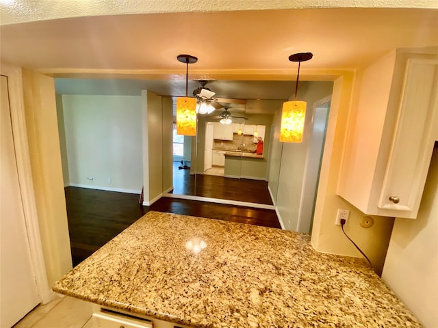 11550 Chimney Rock Rd Unit 329, Houston, TX 77035 - unfurnished dining area with wood finished floors, ceiling fan, and baseboards