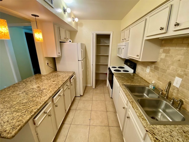 11550 Chimney Rock Rd Unit 329, Houston, TX 77035 - kitchen featuring white appliances, a sink, tasteful backsplash, light tile patterned floors, and white cabinets