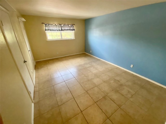 11550 Chimney Rock Rd Unit 329, Houston, TX 77035 - empty room featuring light tile patterned flooring and baseboards
