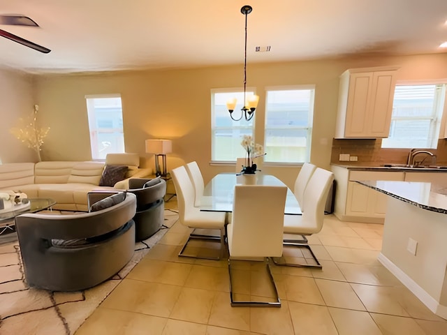 7927 Tindarey Maple Trce, Richmond, TX 77407 - dining space featuring light tile patterned flooring and a chandelier