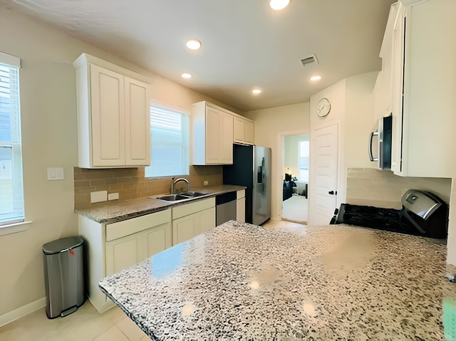 7927 Tindarey Maple Trce, Richmond, TX 77407 - kitchen with a sink, stainless steel appliances, backsplash, white cabinets, and recessed lighting