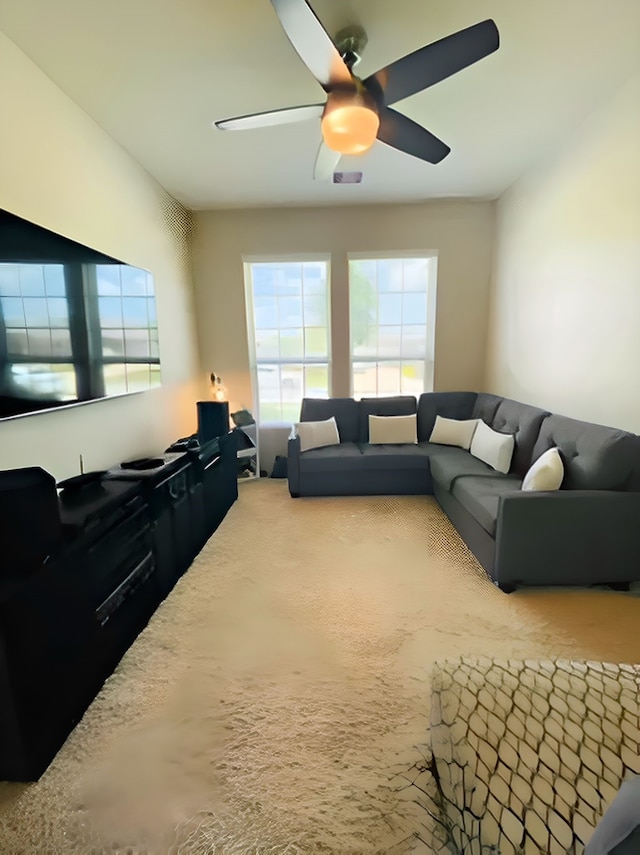 7927 Tindarey Maple Trce, Richmond, TX 77407 - living area featuring healthy amount of natural light, ceiling fan, and carpet