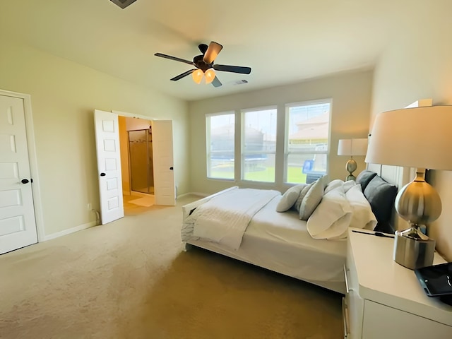 7927 Tindarey Maple Trce, Richmond, TX 77407 - carpeted bedroom featuring baseboards, connected bathroom, and a ceiling fan