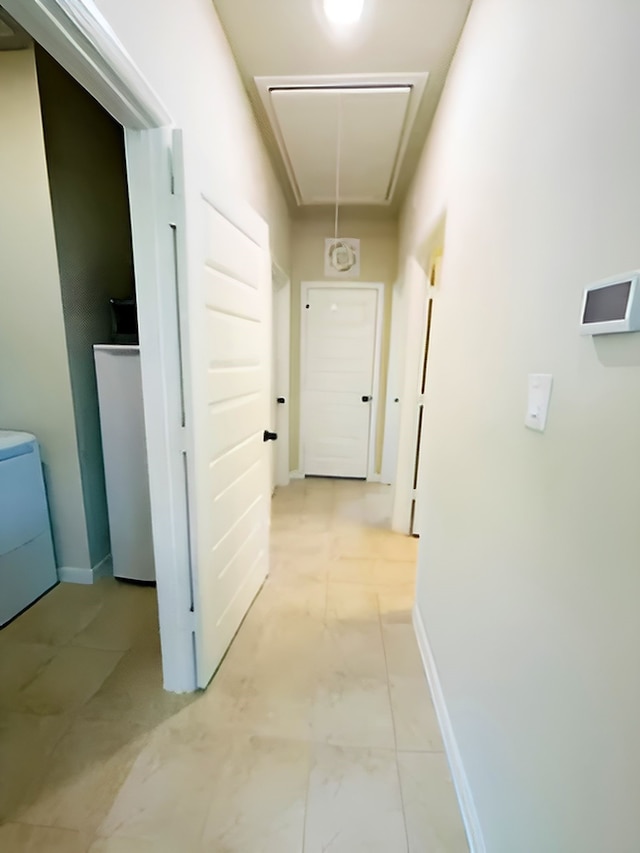 7927 Tindarey Maple Trce, Richmond, TX 77407 - corridor with attic access, light marble finish flooring, and baseboards