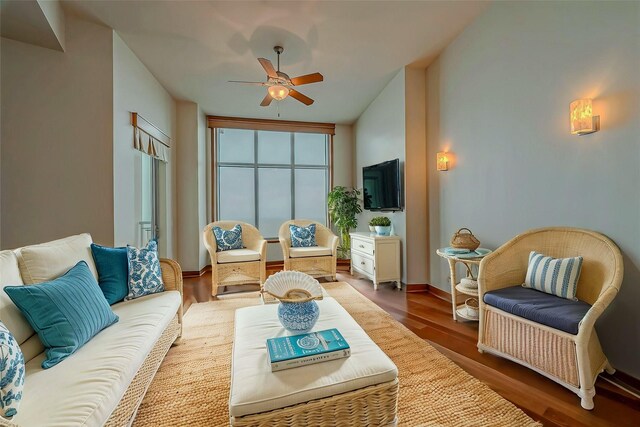 801 E Beach Dr Unit Tw2806, Galveston, TX 77550 - living area with ceiling fan and wood finished floors