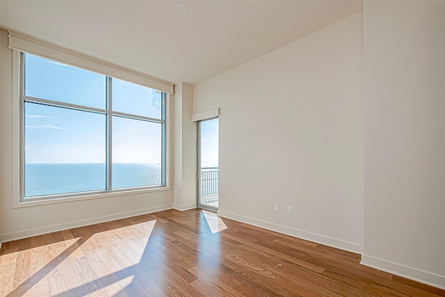 801 E Beach Dr Unit Tw2806, Galveston, TX 77550 - spare room featuring wood finished floors and baseboards