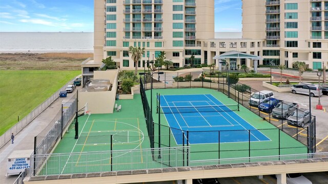 801 E Beach Dr Unit Tw2806, Galveston, TX 77550 - view of tennis court featuring a water view