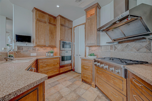 801 E Beach Dr Unit Tw2806, Galveston, TX 77550 - kitchen featuring a sink, wall chimney exhaust hood, stainless steel gas stovetop, tasteful backsplash, and recessed lighting