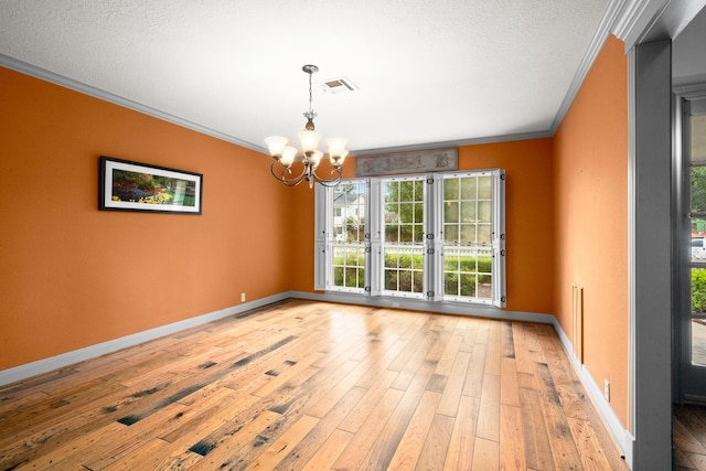 13106 Lookout Mountain Ct, Houston, TX 77069 - empty room with crown molding, a chandelier, light wood-type flooring, and a textured ceiling
