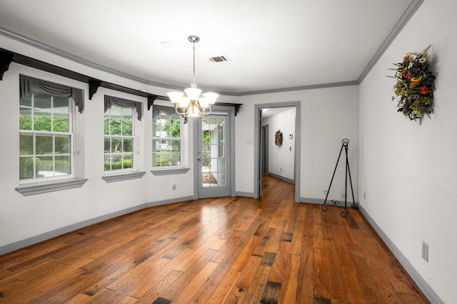 13106 Lookout Mountain Ct, Houston, TX 77069 - unfurnished dining area featuring a chandelier, plenty of natural light, hardwood / wood-style flooring, and ornamental molding
