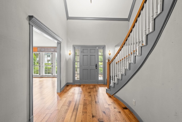 13106 Lookout Mountain Ct, Houston, TX 77069 - foyer with light wood-style floors, stairs, and a towering ceiling