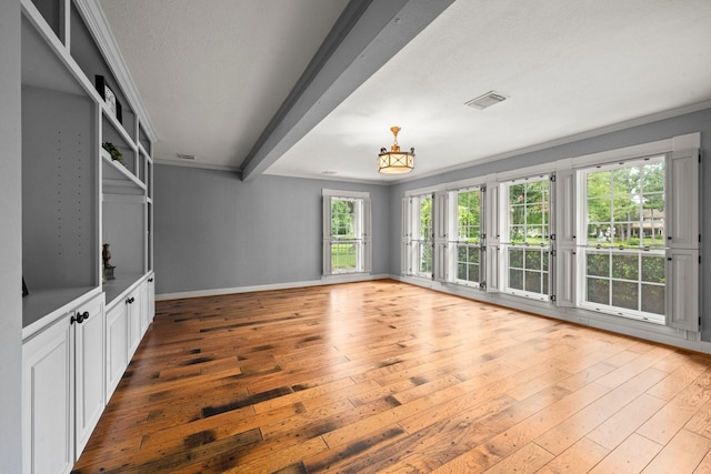 13106 Lookout Mountain Ct, Houston, TX 77069 - unfurnished living room featuring wood-type flooring, healthy amount of natural light, and a textured ceiling