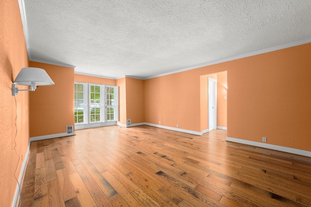 13106 Lookout Mountain Ct, Houston, TX 77069 - empty room with crown molding, hardwood / wood-style flooring, and a textured ceiling