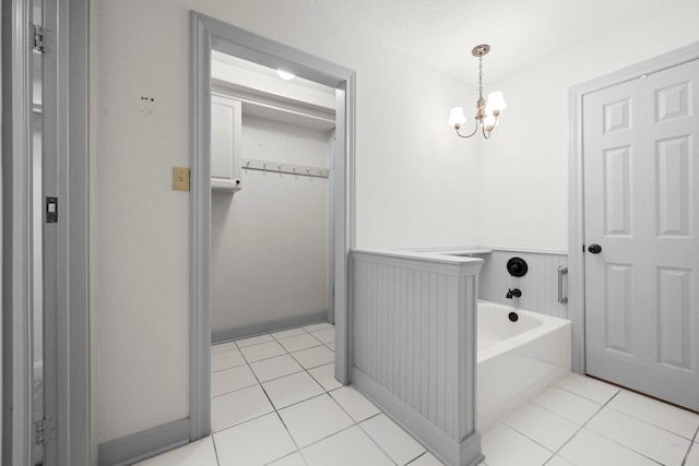 13106 Lookout Mountain Ct, Houston, TX 77069 - full bathroom featuring a chandelier, a wainscoted wall, a garden tub, and tile patterned flooring