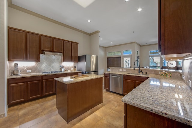 14610 Thunder Bay, Beach City, TX 77523 - kitchen featuring appliances with stainless steel finishes, crown molding, a sink, tasteful backsplash, and light stone counters