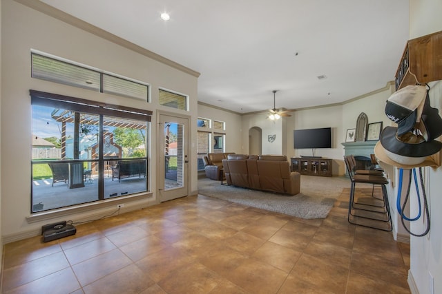 14610 Thunder Bay, Beach City, TX 77523 - living room featuring crown molding, a ceiling fan, arched walkways, baseboards, and recessed lighting
