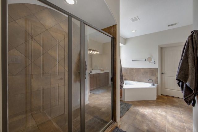 14610 Thunder Bay, Beach City, TX 77523 - bathroom with tile patterned flooring, a bath, a stall shower, and vanity