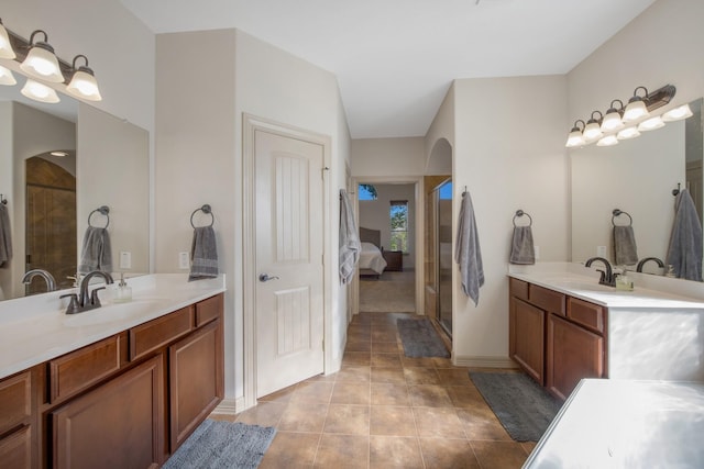 14610 Thunder Bay, Beach City, TX 77523 - bathroom with tile patterned floors, two vanities, and baseboards