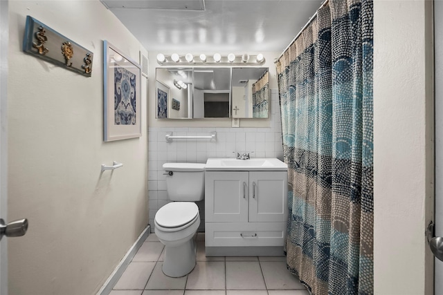 5353 Richmond Ave Unit 6, Houston, TX 77056 - bathroom featuring tile patterned flooring, toilet, vanity, a shower with curtain, and tile walls