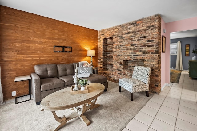 5353 Richmond Ave Unit 6, Houston, TX 77056 - living area featuring light tile patterned floors, wooden walls, and an accent wall