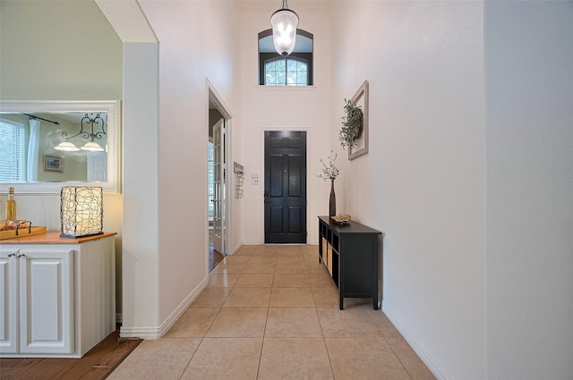 5003 Crystal Wind Ln, Katy, TX 77494 - foyer entrance with a towering ceiling, baseboards, and light tile patterned floors