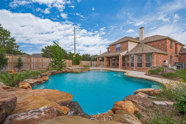 5003 Crystal Wind Ln, Katy, TX 77494 - view of pool featuring a fenced backyard, a patio, and a pool with connected hot tub