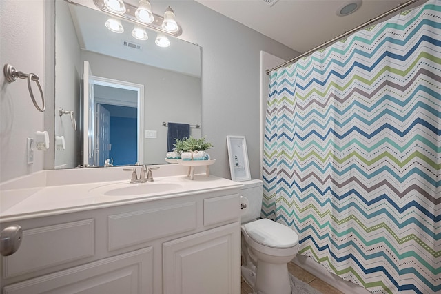 5003 Crystal Wind Ln, Katy, TX 77494 - full bathroom with toilet, vanity, a shower with curtain, and tile patterned flooring