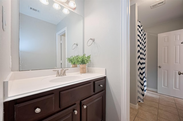 5003 Crystal Wind Ln, Katy, TX 77494 - bathroom with vanity, tile patterned floors, curtained shower, and baseboards