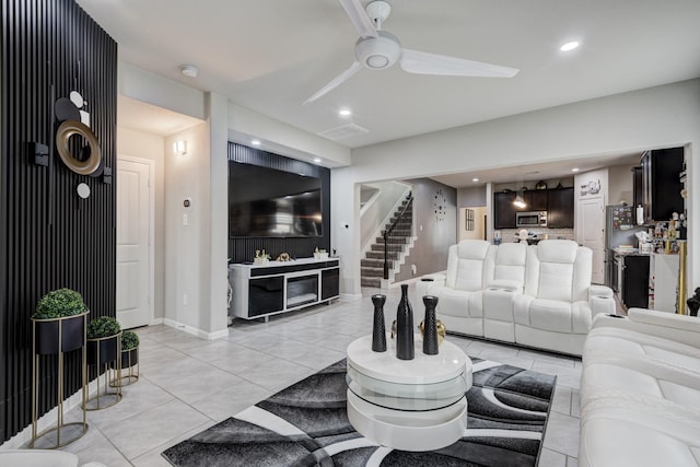 18214 Grayson Bluff Way, Richmond, TX 77407 - living area with a ceiling fan, stairs, light tile patterned floors, recessed lighting, and baseboards