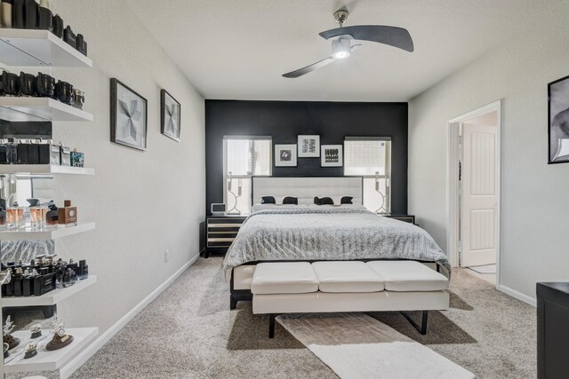 18214 Grayson Bluff Way, Richmond, TX 77407 - bedroom with light colored carpet, ceiling fan, and baseboards