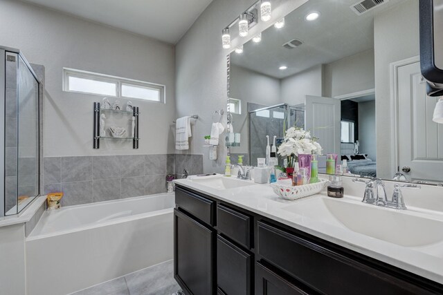 18214 Grayson Bluff Way, Richmond, TX 77407 - bathroom with a garden tub, a stall shower, double vanity, ensuite bathroom, and tile patterned floors