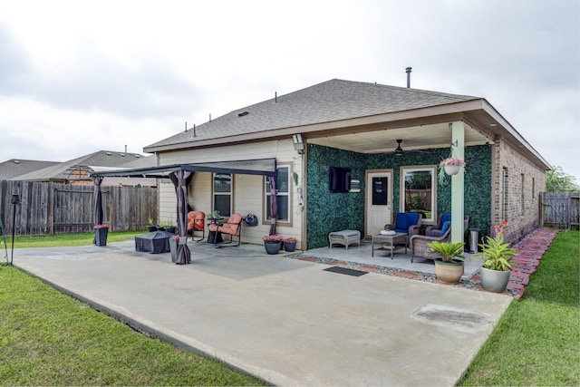 18214 Grayson Bluff Way, Richmond, TX 77407 - back of property featuring a patio, ceiling fan, a fenced backyard, and roof with shingles