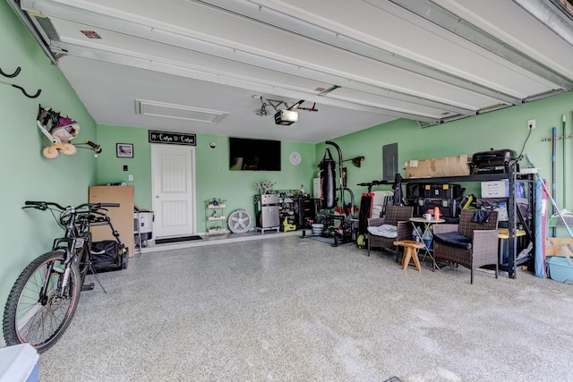 18214 Grayson Bluff Way, Richmond, TX 77407 - garage featuring electric panel and a garage door opener