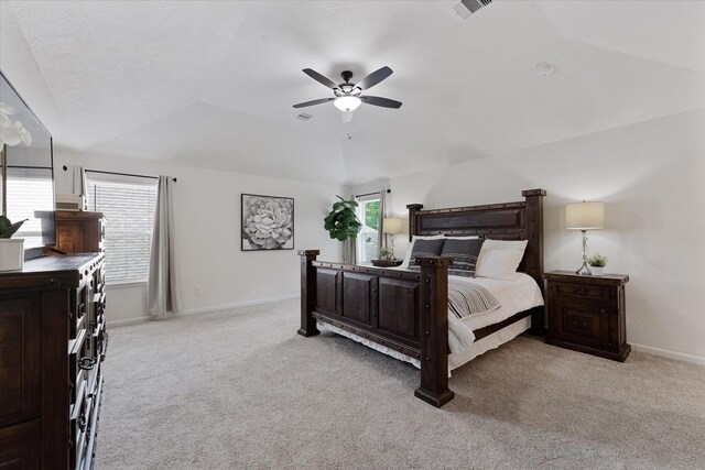 3933 Eagle Nest Lake Ln, Magnolia, TX 77354 - carpeted bedroom featuring vaulted ceiling, baseboards, and ceiling fan