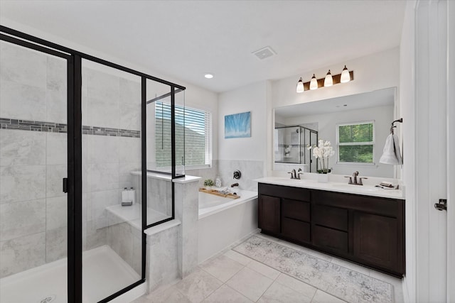 3933 Eagle Nest Lake Ln, Magnolia, TX 77354 - bathroom with a garden tub, a shower stall, double vanity, and tile patterned flooring