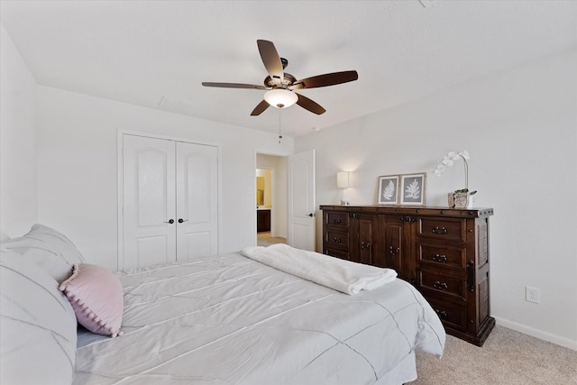 3933 Eagle Nest Lake Ln, Magnolia, TX 77354 - bedroom with a closet, light colored carpet, baseboards, and a ceiling fan