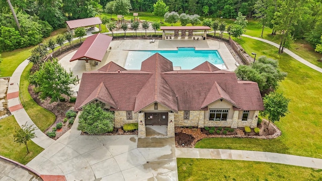 3933 Eagle Nest Lake Ln, Magnolia, TX 77354 - aerial view of property and surrounding area featuring a pool
