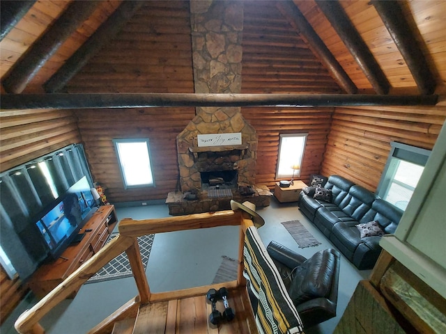 21403 Briar Meadow Rd N, Hempstead, TX 77445 - living area with wood ceiling with exposed beams, rustic walls, a stone fireplace, plenty of natural light, and high vaulted ceiling