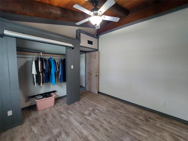 21403 Briar Meadow Rd N, Hempstead, TX 77445 - unfurnished bedroom with wood finished floors, baseboards, wood ceiling with exposed beams, and ceiling fan