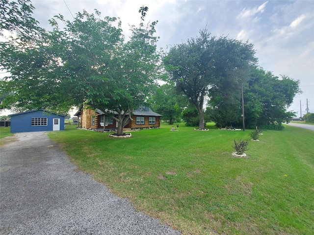 21403 Briar Meadow Rd N, Hempstead, TX 77445 - view of front of home featuring driveway and a front lawn