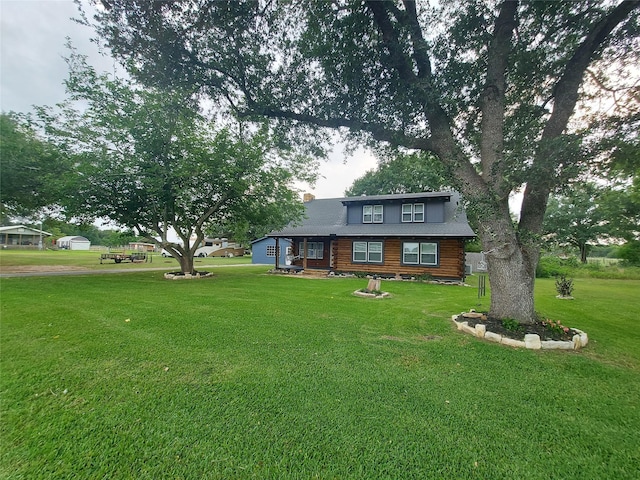 21403 Briar Meadow Rd N, Hempstead, TX 77445 - cabin featuring log exterior, a front lawn, and a chimney