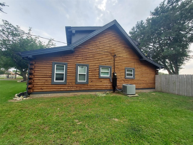 21403 Briar Meadow Rd N, Hempstead, TX 77445 - back of house featuring central AC and log siding