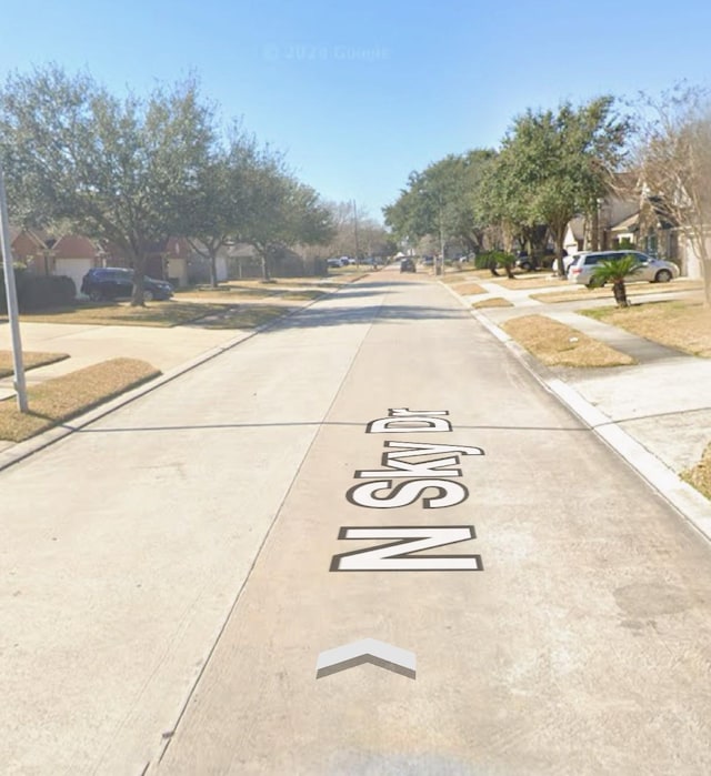 922 N Sky Dr, Houston, TX 77073 - view of concrete street featuring sidewalks, curbs, and a residential view