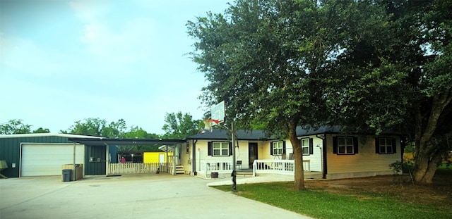 1610 Marilyn St, Alvin, TX 77511 - view of front of home with driveway and a porch